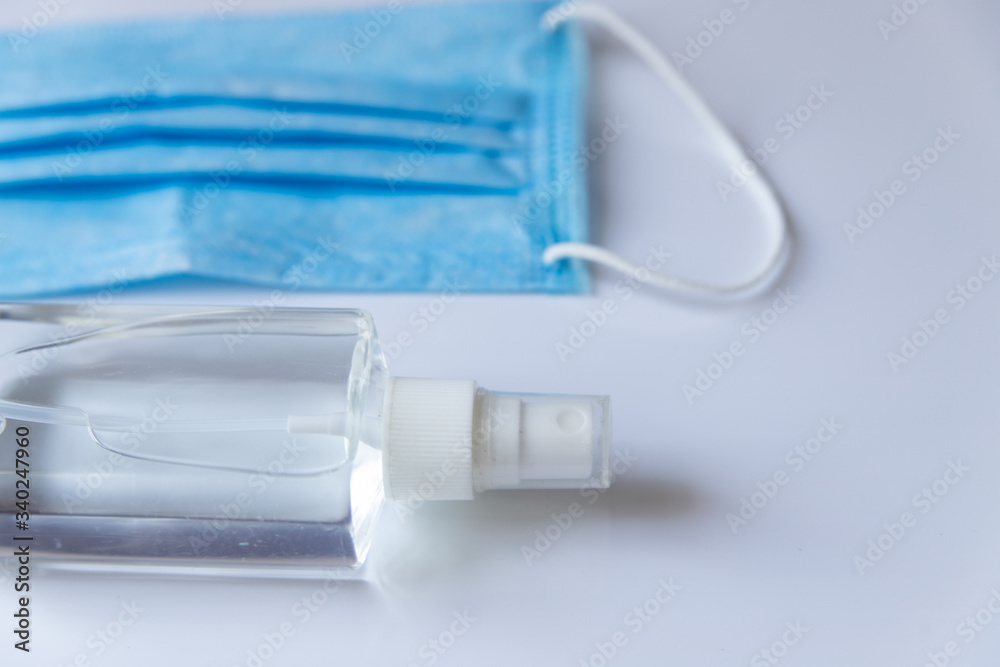 Coronavirus corona virus prevention travel surgical masks and hand sanitizer gel for hand hygiene spread protection. Coronavirus corona virus prevention travel surgical masks and hand sanitizer gel for hand hygiene spread protection.