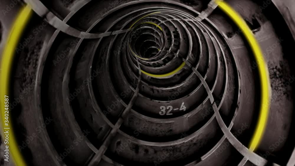 Flying through a bending grey concrete bulkhead tunnel with yellow ...