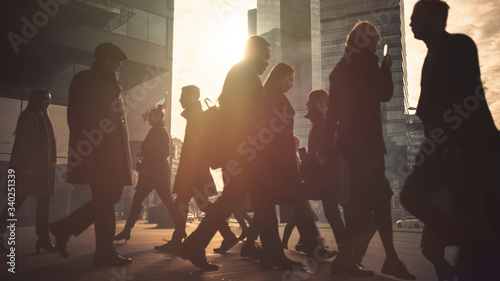 Fotografie Office Managers and Business People Commute to Work in the Morning or from Office on a Sunny Day on Foot