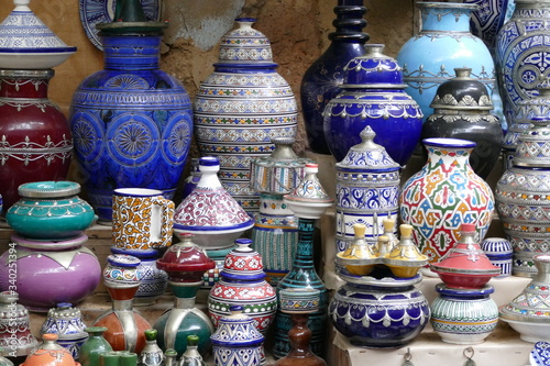 Close-up of beautiful handmade ceramic pottery on display in a shop of the medina of Marrakesh 