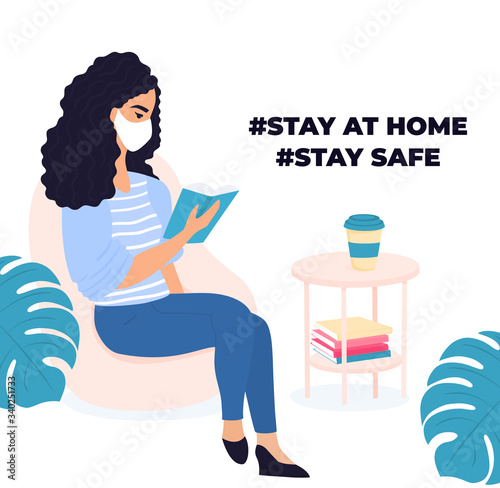 Learning at home. Woman is reading a book. Quarantine during a coronavirus COVID-19. Self isolation. Girl getting ready for the exam