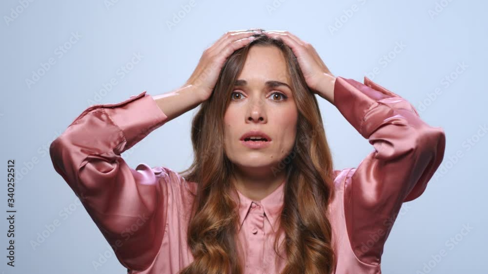 Stressed woman touching head with hands. Entrepreneur having stress after work
