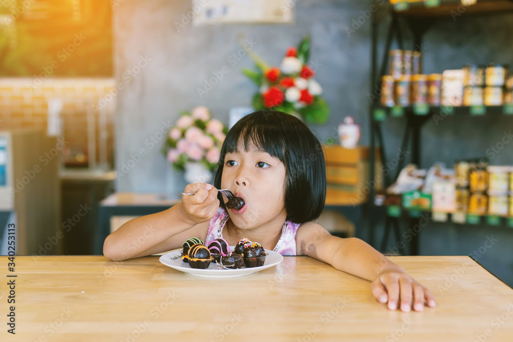 Happy cute child girl on the blur green background. Happy cute child girl on the blur green background.