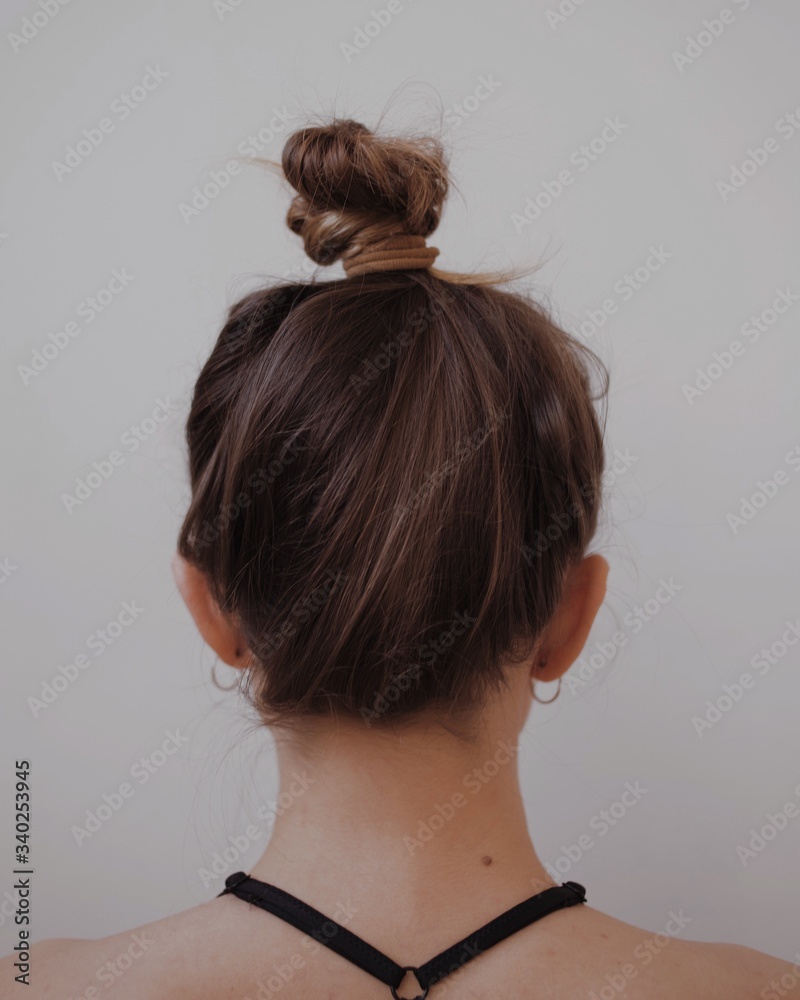 woman neck from the back with hair woman neck from the back with hair