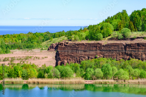 Rock Wall in an old quarry with a lake