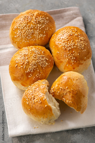Homemade fresh bread buns with sesame seeds.