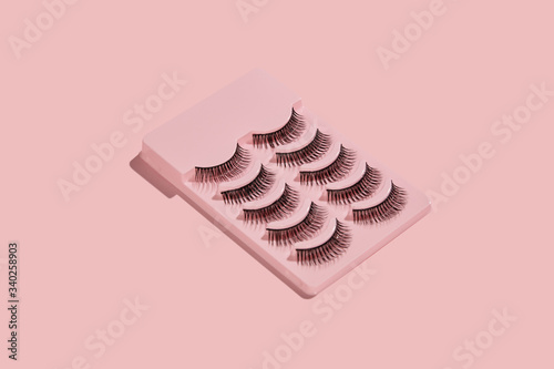 Bild auf Leinwand a pink box with five pairs of false lashes on pink background