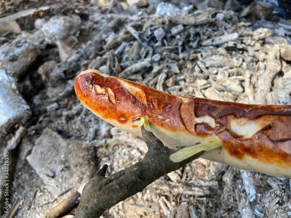 Fototapeta premium one sausages over an embers