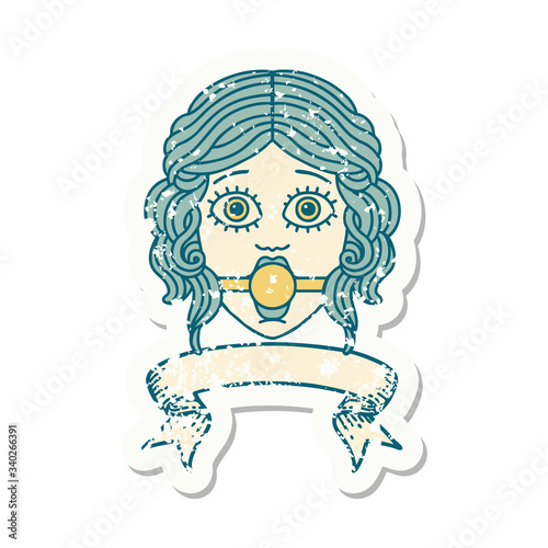 grunge sticker with banner of female face with ball gag