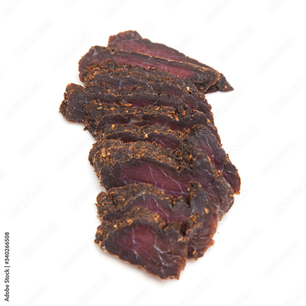 Beef Biltong, South African Beef Jerky isolated on a white studio background.