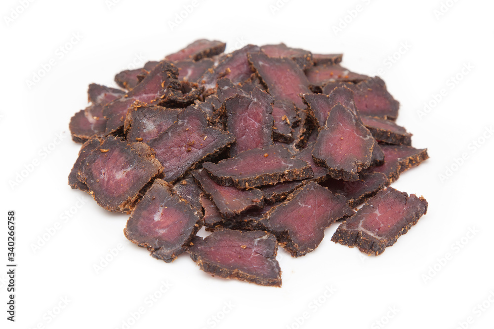 Beef Biltong, South African Beef Jerky isolated on a white studio background.