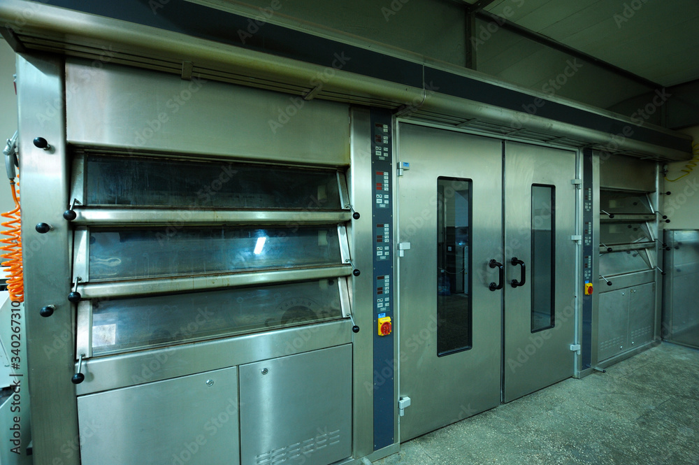 At the bakery: three-section electric oven prepared for baking bread At the bakery: three-section electric oven prepared for baking bread