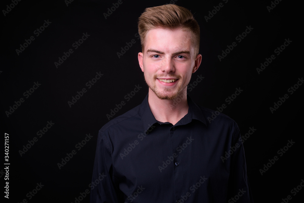 Obraz premium Portrait of young handsome blond bearded businessman