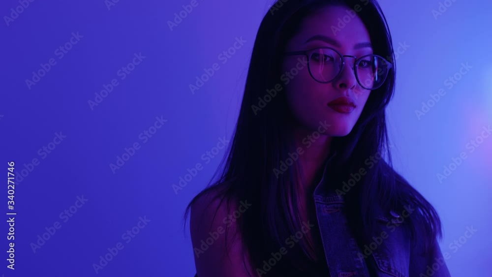 Studio Portrait of Asian Woman with Neon Lights.