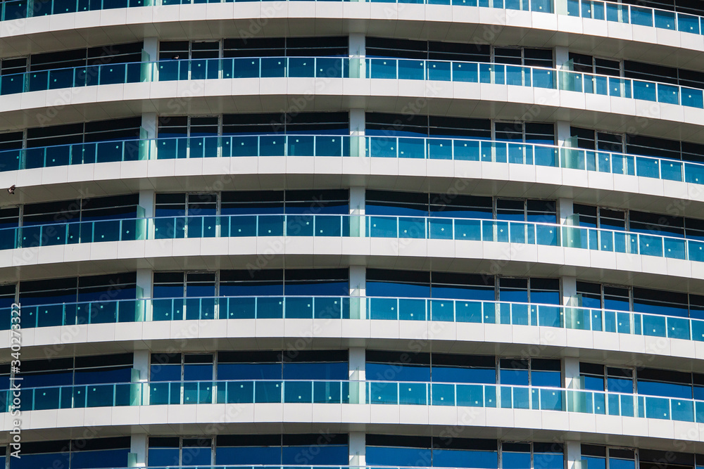 Windows and balconies on facade of new building in city. Windows and balconies on facade of new building in city.