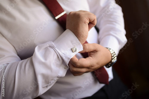 Businessman preparing for business. Suit and fashion