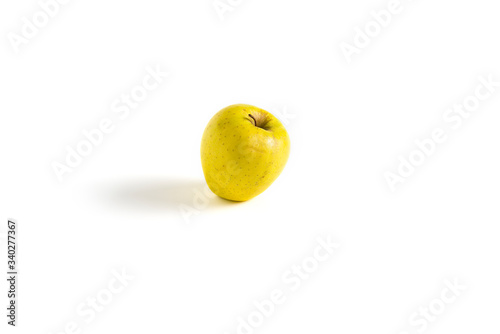 Isolated yellow apple on white background.