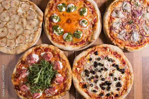 Freshly served various pizzas
