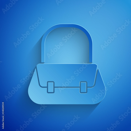 Paper cut Handbag icon isolated on blue background. Female handbag sign. Glamour casual baggage symbol. Paper art style. Vector Illustration