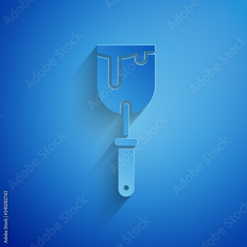 Paper cut Putty knife icon isolated on blue background. Spatula repair tool. Spackling or paint instruments. Paper art style. Vector Illustration