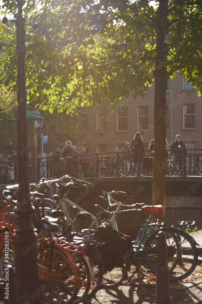 View of a bridge and bikes in Amsterdam on a sunny day