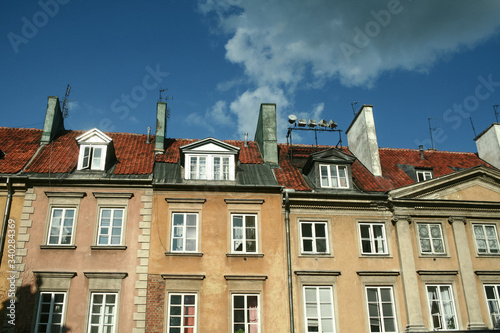 Typical Medieval Facade of an old appartment residential building in a street of old town, the historical center of Warsaw, Poland, in the most touristic part of the city