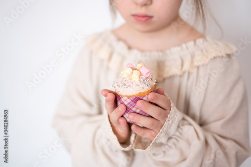children's hands hold the Easter cake, protection and care, health and charity, faith and celebration