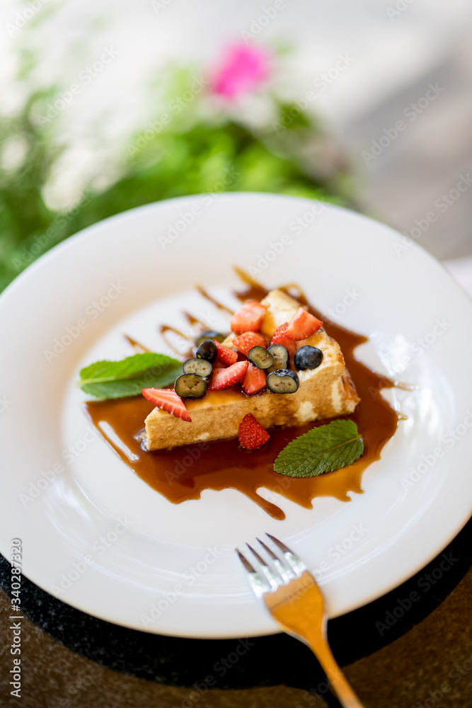 Cheesecake with berries ans caramel and mint Cheesecake with berries ans caramel and mint