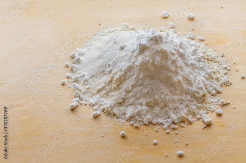 Products for dough, flour, sugar on the board.