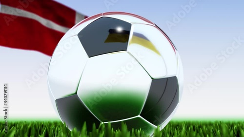 Seamless looping 3d animation of a soccer ball reflecting the flags of Ukraine and Denmark in 4K resolution