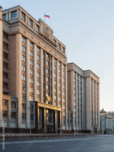 Building of State Duma of Russia (inscribed - State Parliament). Deserted Okhotny Ryad street. Moscow, Russia. photo