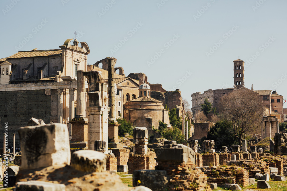 View of the ruins of a Roman forum with famous sights in Rome, Italy. Roman Forum in the heart of ancient Rome.	