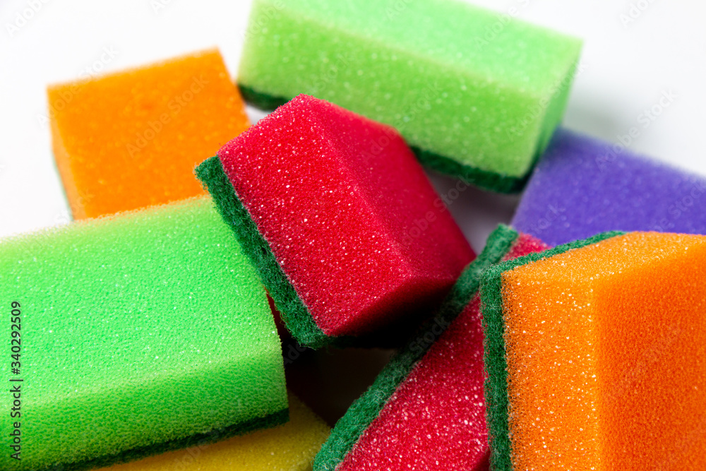 Colored sponges close up on a white background. Sponges for dishwashing Colored sponges close up on a white background. Sponges for dishwashing