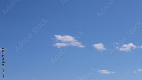 Spring blue sky with clouds. Background of blue sky and clouds.