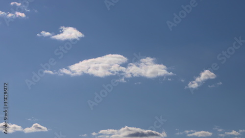 Spring blue sky with clouds. Background of blue sky and clouds.