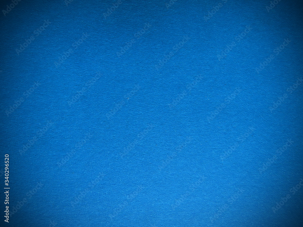 Blue paper texture. Beautiful blue background with darkened edges. Illustration can be used as background or layout