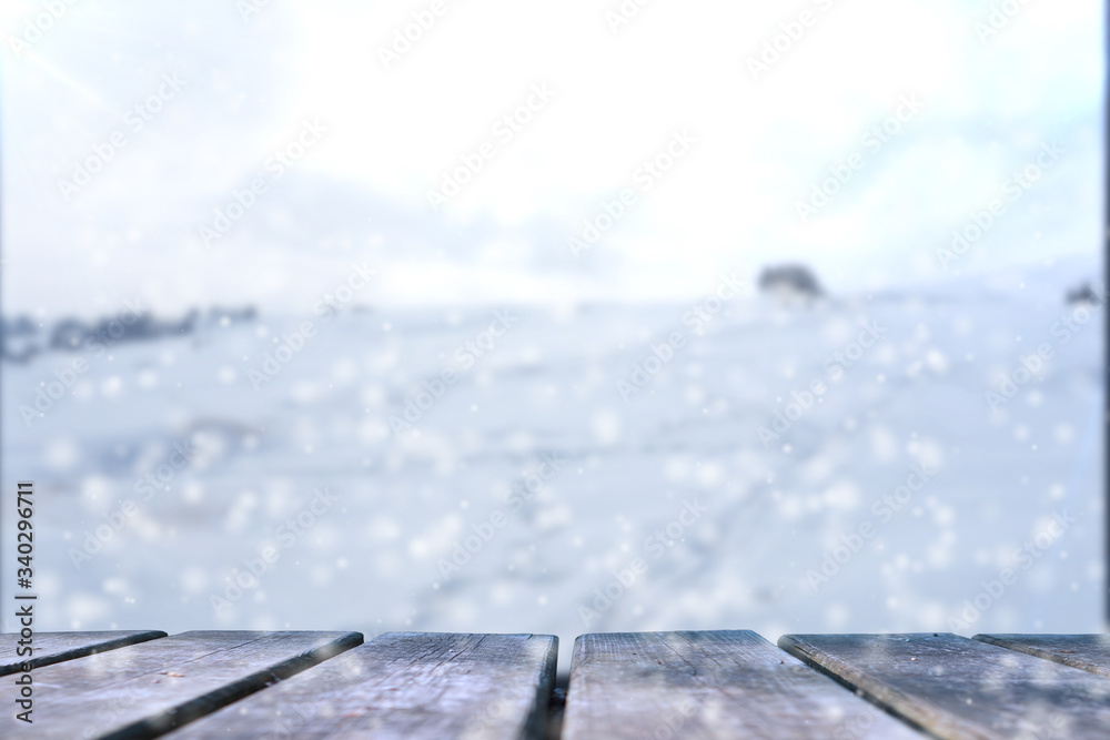 Empty wooden base suitable for mockup. Snow background theme.