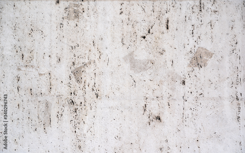 old concrete background wall damaged with holes and stains
