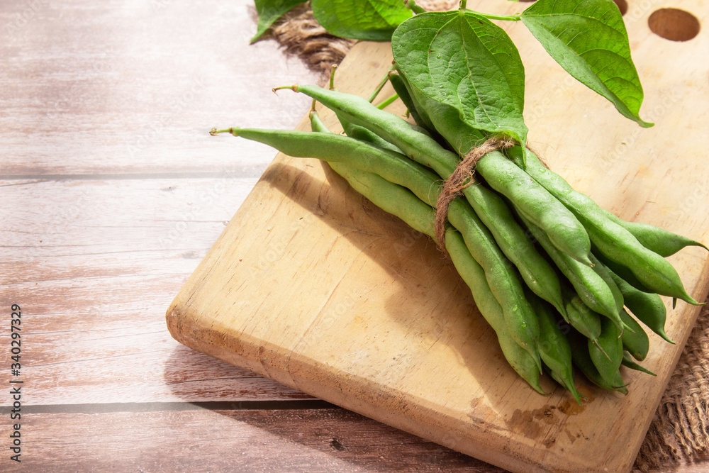 Green beans close up on wooden background Green beans close up on wooden background