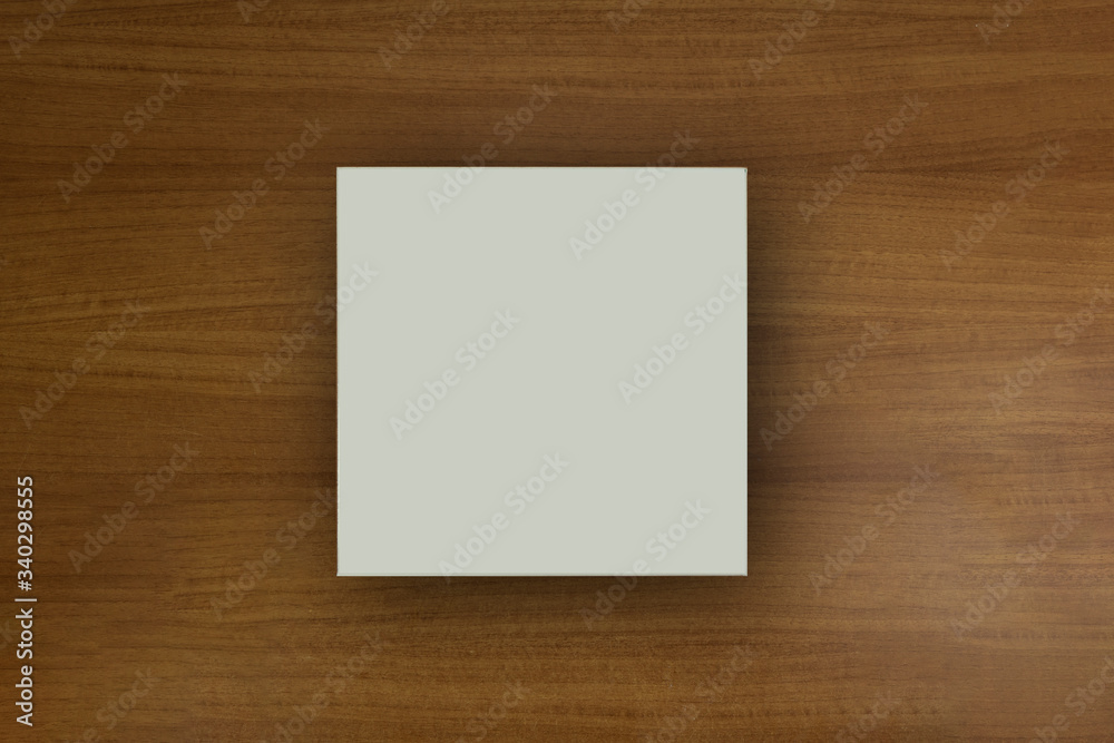 White empty paper square in dark background for mockup purposes White empty paper square in dark background for mockup purposes