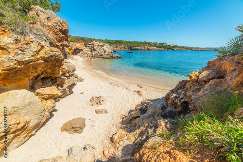 Fototapeta Naklejka Na Ścianę i Meble -  Rocks and sand in Alghero shore in springtime