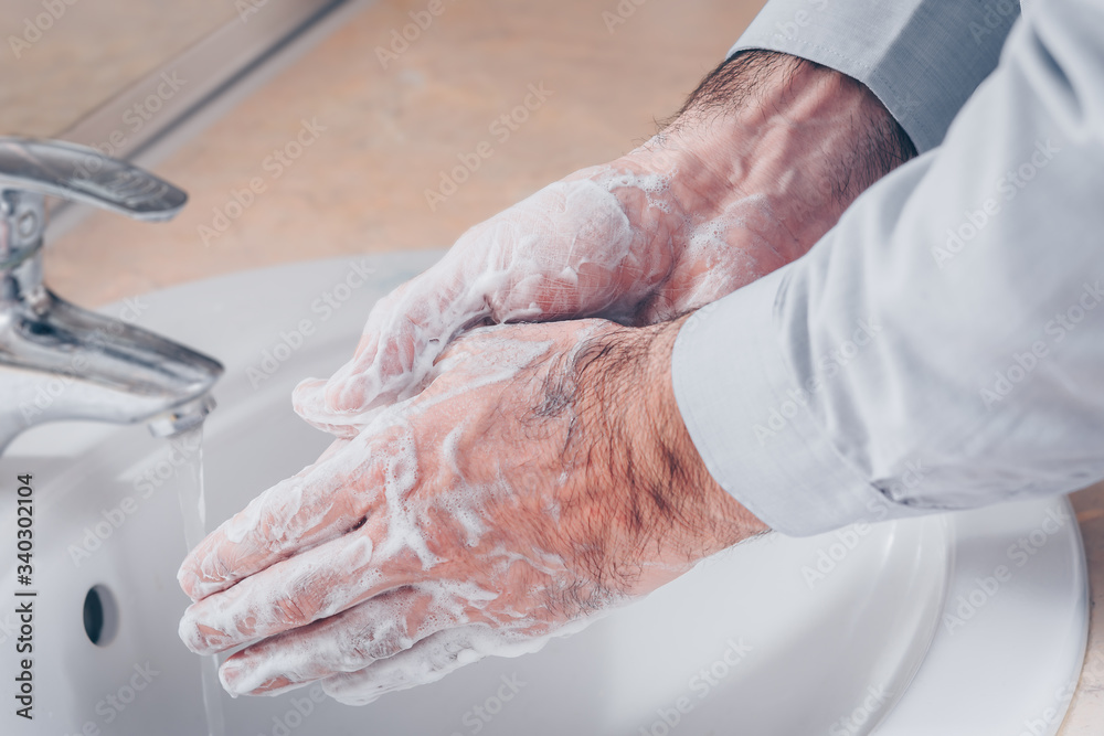 Fototapeta premium Washing hands rubbing with soap man for corona virus prevention, hygiene to stop spreading coronavirus.