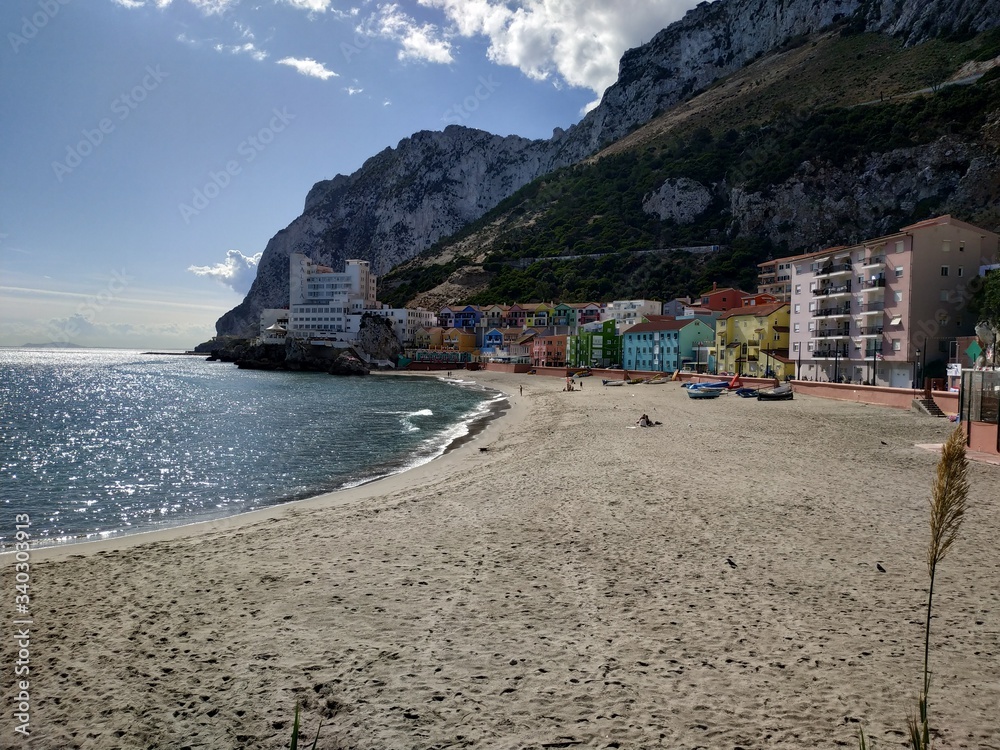 GIBRALTAR, UK - OCTOBER 21, 2019: casual view on the seaside streets near Gibraltar Big rock