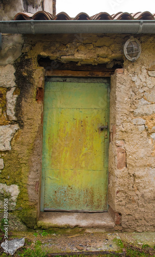An old door in a derelict building in the historic hill village of Stanjel in the Komen municipality of Primorska, south west Slovenia.  © dragoncello