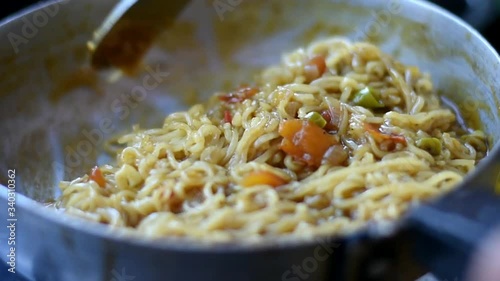 woman making a maggie in indian style