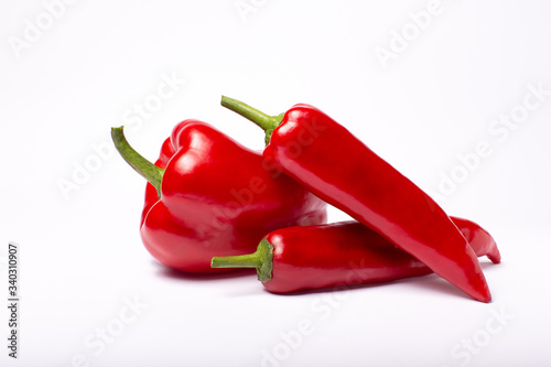 Red sweet peppers isolated on white background. Top view photo