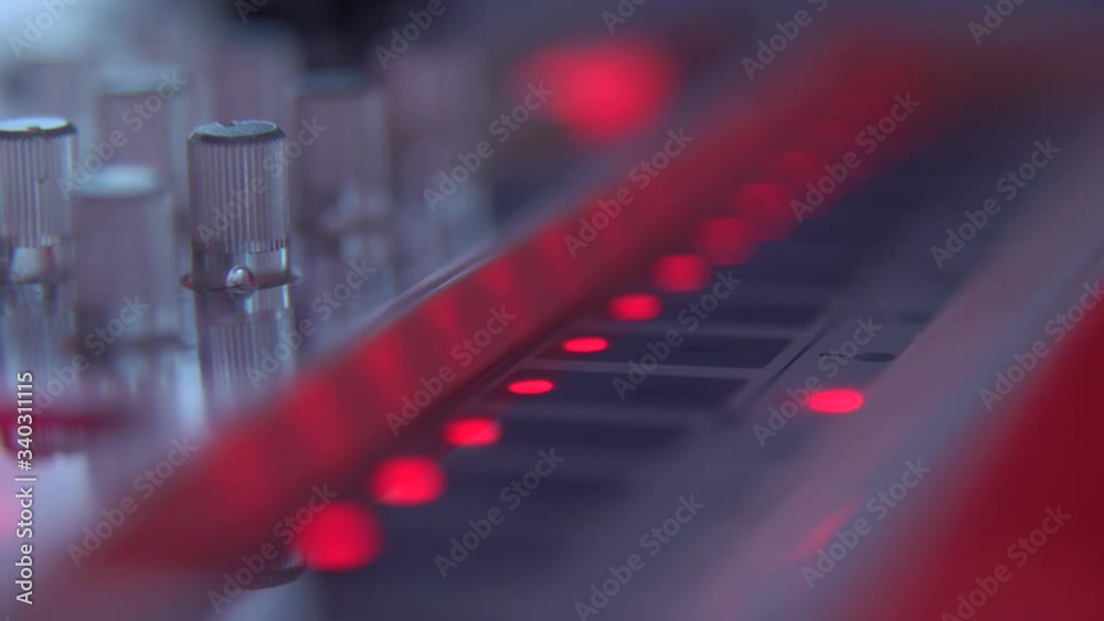 Extreme Close up shot of man's hands drum sticks on sampler and electronic pads Extreme Close up shot of man's hands drum sticks on sampler and electronic pads