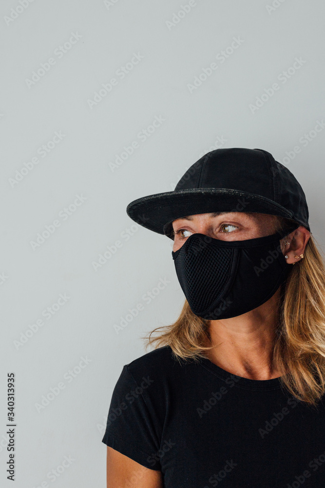 Pandemic, coronavirus, a woman in a protective mask, against the spread of the disease. COVID-19. Quarantine at home. Pandemic, coronavirus, a woman in a protective mask, against the spread of the disease. COVID-19. Quarantine at home.