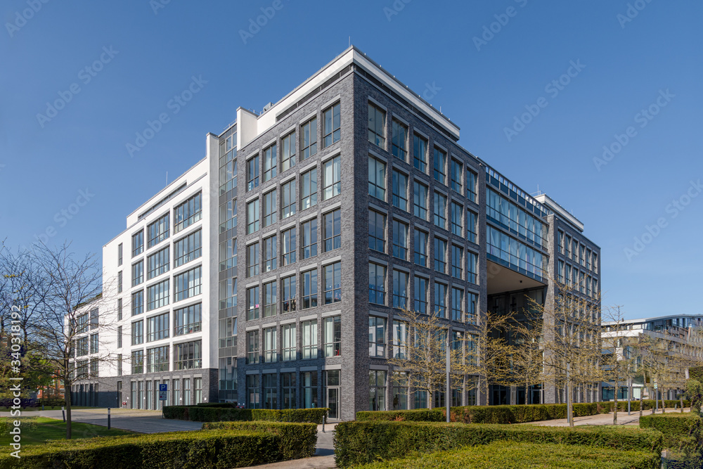 Modern architecture office building with dark bricks and big windows Modern architecture office building with dark bricks and big windows
