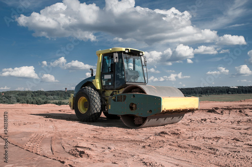 soil compactor against the sky